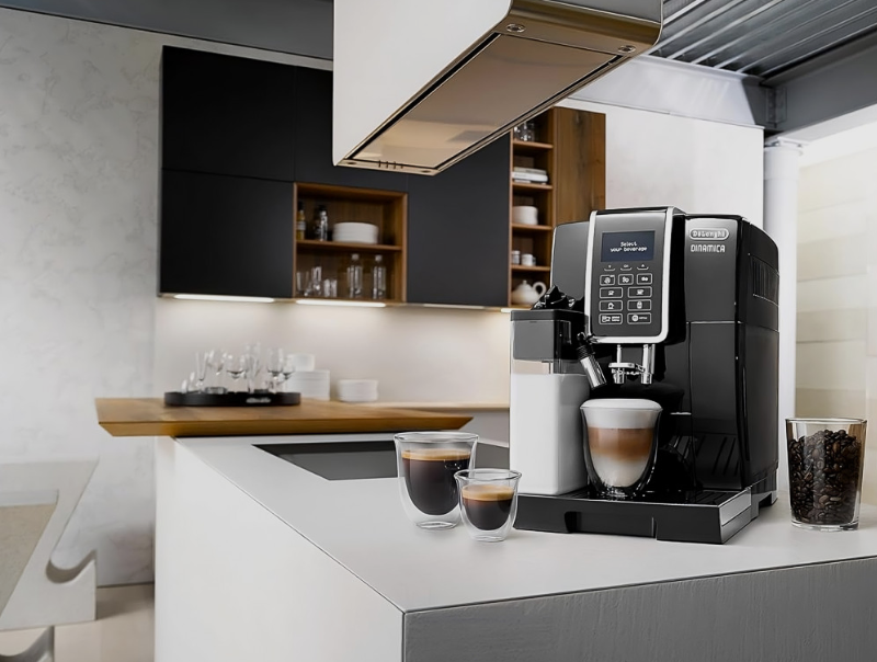 Bean to cup coffee machine on a kitchen counter with coffees around it